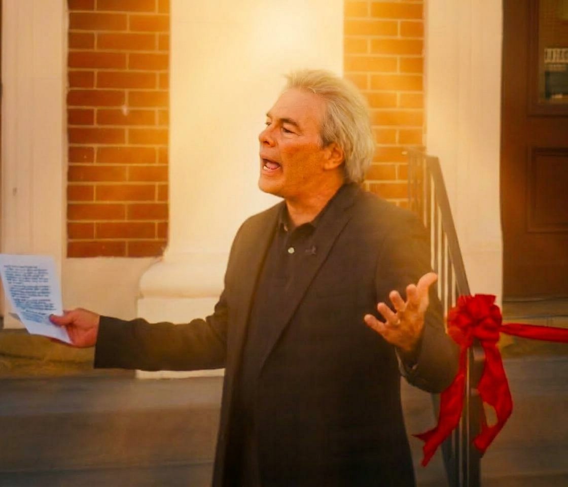 Pastor Steve Tharp speaking outside the church